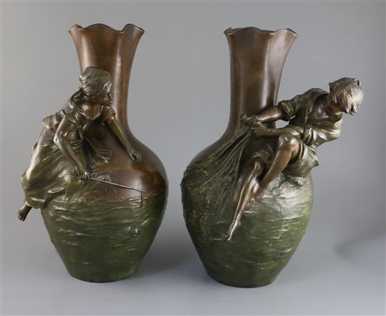 After Auguste Moreau. A pair of bronzed pewter figural vases, 15in.